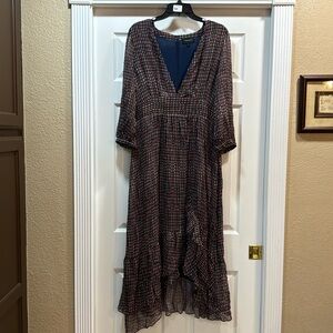 Beautiful dress, plunging neckline. Fully lined, double ruffle with front slit.